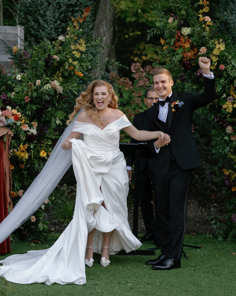 excited bride and groom right after ceremony 